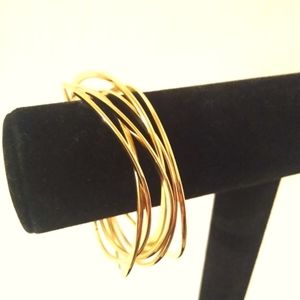 Set of 6 gold tone Cookie Lee Bangles